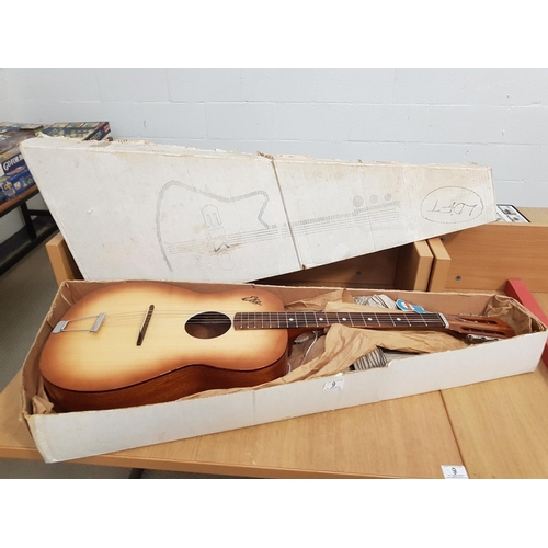9 - An Eko six string Modelo P2 guitar - 1960 in original box and packaging