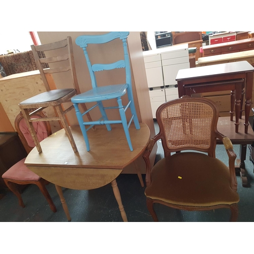 530 - A drop leaf dining table and four chairs.