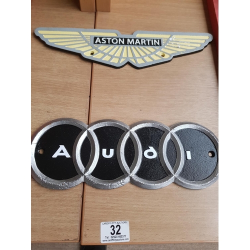 32 - Cast iron Astin Martin and Audi Signs