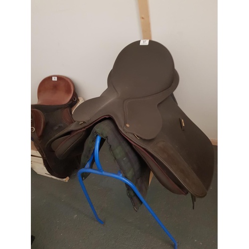 97 - A Wintec 'Wide' brown saddle with tartan saddle pad