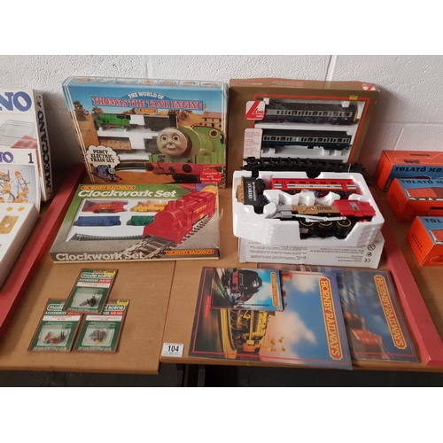 104 - A boxed Lima carriage set, boxed Hornby clockwork set and a boxed Hornby 'Thomas the Tank engine 'Pe... 