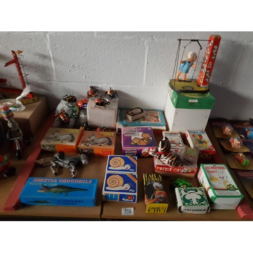 112 - A selection of retro tin plate wind up toys including 2 x jumping zebras, lucky mouse, ladybird etc