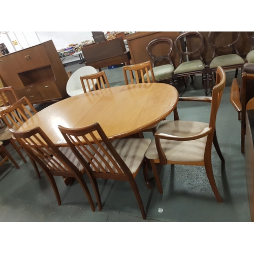 231 - A g plan oval extending dining table and six chairs