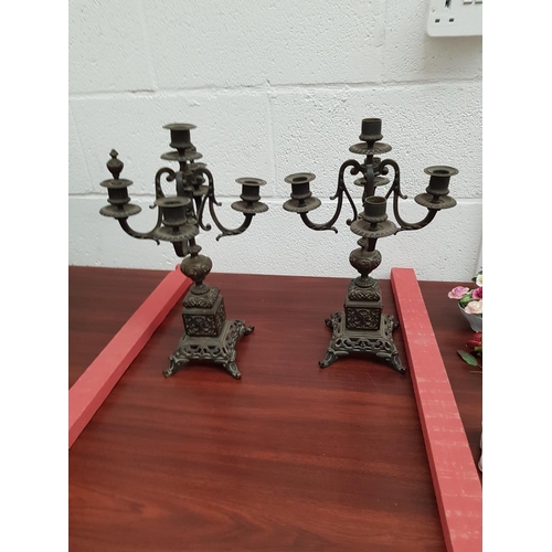 60 - A pair of early bronze candleabras