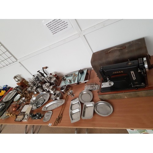 73 - A Jones sewing machine and a selection of brass and silver plated items