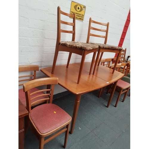 511 - A teak extendable dining table and 6 chairs
