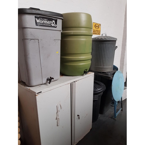 519 - A 2 door metal cabinet, 2 water drums and 2 waste bins etc