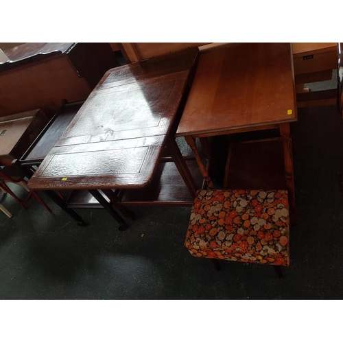528 - 2 tea trolleys a wooden table and small upholstered footstool