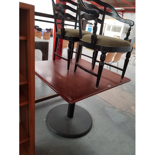 540 - A wooden & metal based table & 2 chairs