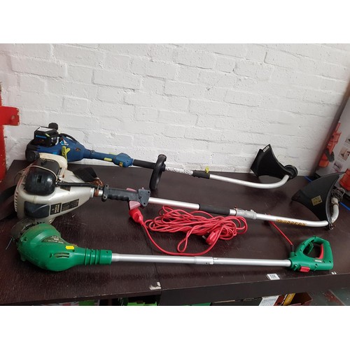 556 - Two petrol strimmers, one Spear and Jackson and one Challenge Extreme plus a Qualcast electrical str... 