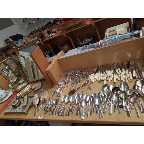 20 - A collection of flatware, dressing table set, mirror etc