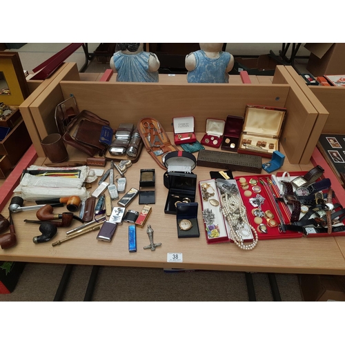 38 - A selection of costume jewellery and watches,lighters and pipes etc