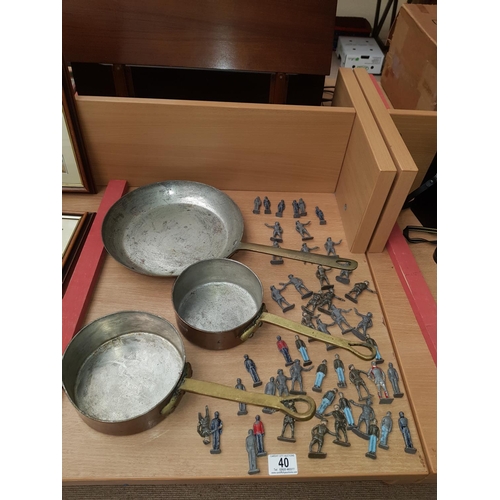 40 - 3 copper pans and a quantity of lead soldiers