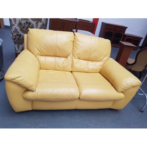 785 - A yellow two seater sofa