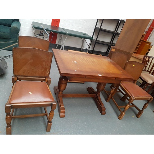335 - A draw leaf extending table and 4 chairs