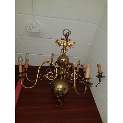 49 - A large Flemish Brass six arm chandelier with Eagle to top