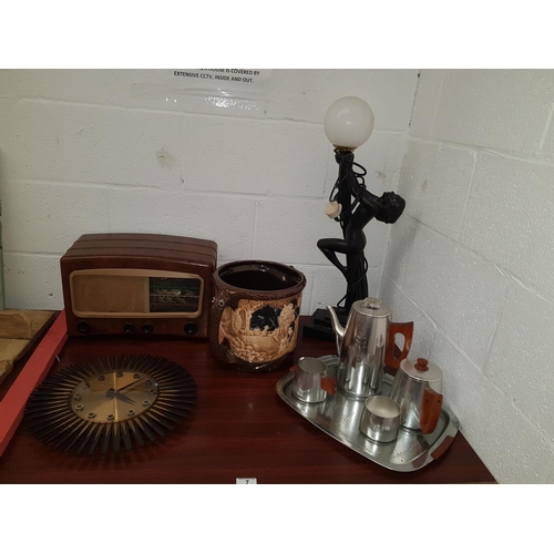 7 - A retro sunburst clock, art deco style figurine lamp, Bakelite valve radio 'Melody Maker' and A Bret... 