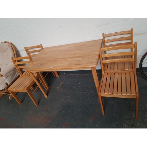 311 - A dining table and four chairs