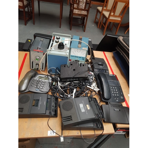 376 - A quantity of electronic machines, telephone handsets etc