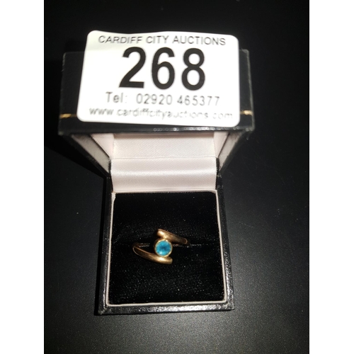 268 - A 9K gold ladies ring with blue stone Size N