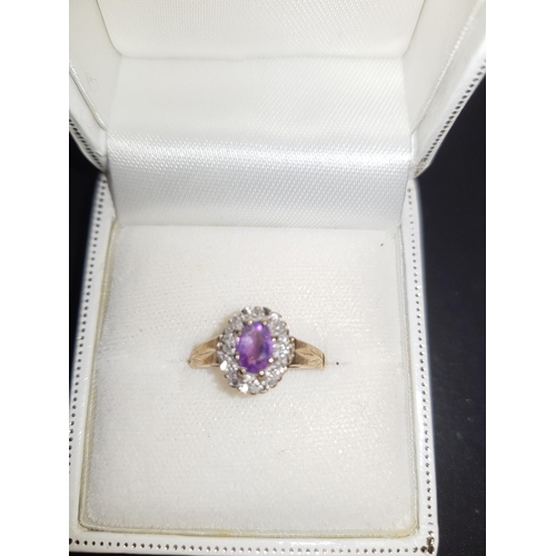 271 - A 9K gold diamond and purple stone ladies ring Size - L