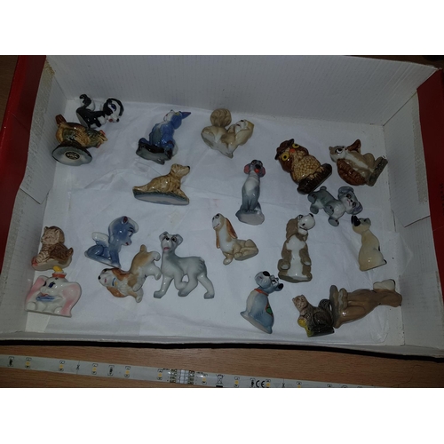 287 - A collection of Wade Whimsies to include a rare chicken and assorted Disney characters - 19 in total