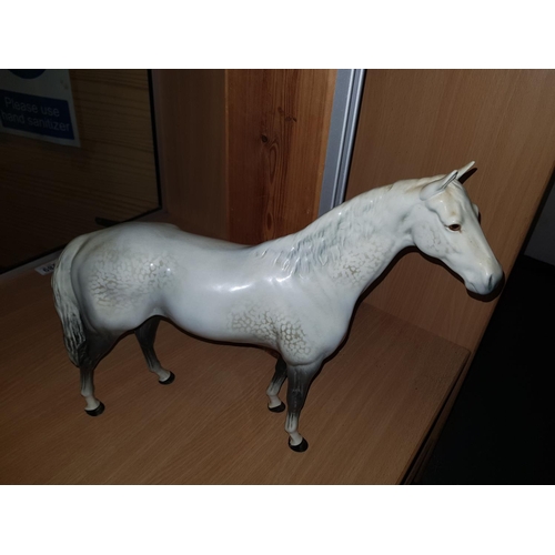 289 - A large Beswick model of a dapple grey hunter Model no 1734