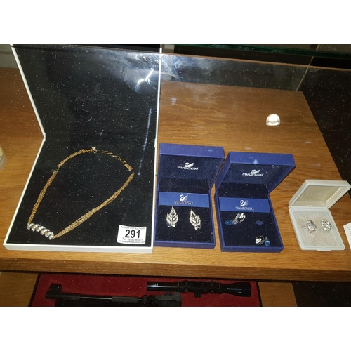 291 - Boxed Swarovski jewellery; 3 sets of earrings and a necklace