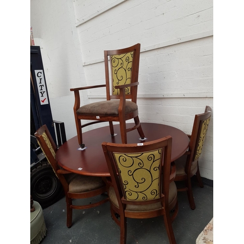 502 - A metal base wooden circular dining table and four chairs