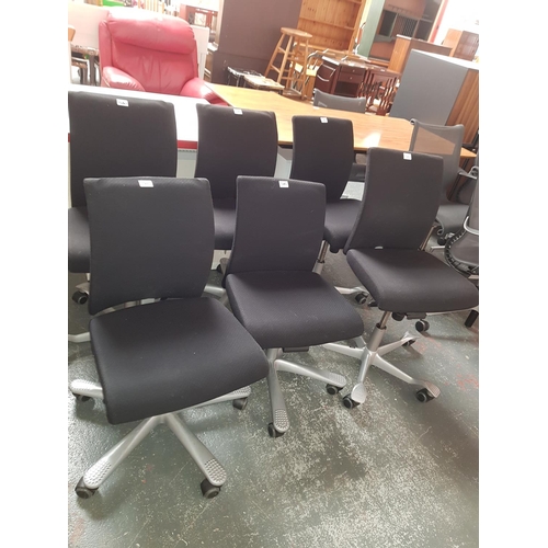 520 - Six black swivel chairs