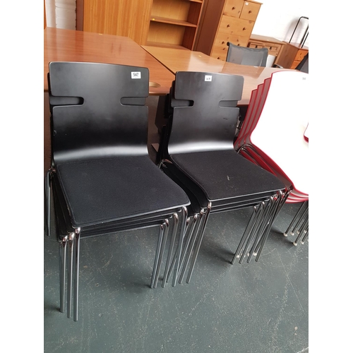 547 - Eight black stacking chairs