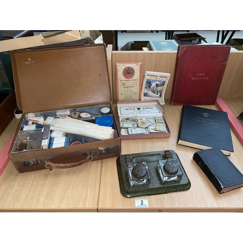 2 - A leather suitcase containing vintage first aid items, a loose Bakelite ink well cigarette cards etc... 