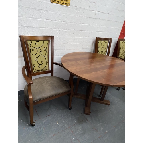 504 - A circular dining table and two chairs