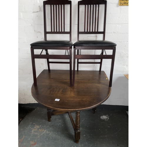 514 - A drop leaf dining table and two chairs