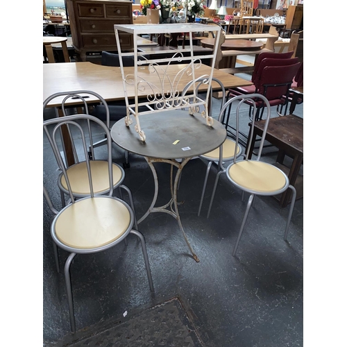 516 - Four metal chairs, metal garden table and a side table