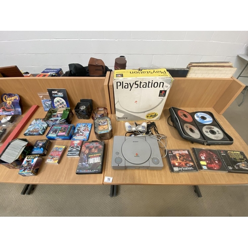 10 - A Playstation one with games, Yu-Gi-Oh collectors cards and Pokemon collectors cards