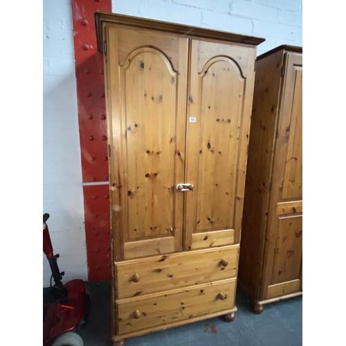 505 - A pine double door wardrobe with drawers