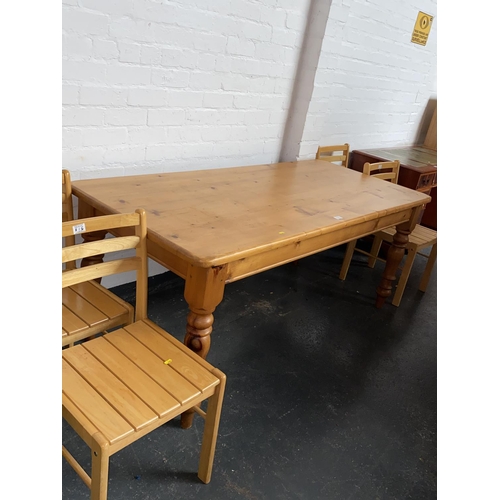 516 - A pine dining table and four chairs