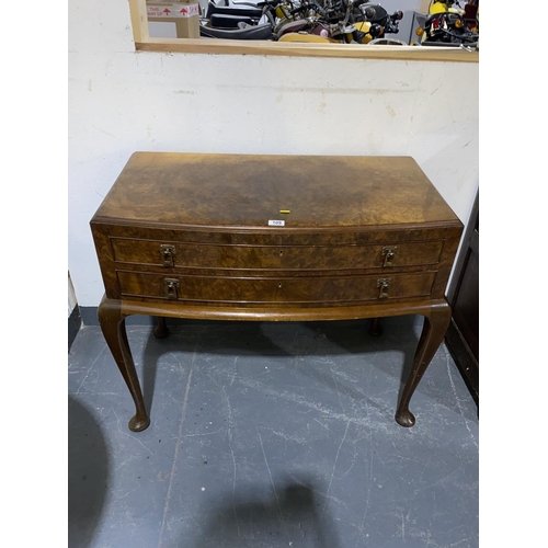 109 - A two drawer walnut canteen cabinet containing a full 12 place setting canteen of silver plated cutl... 