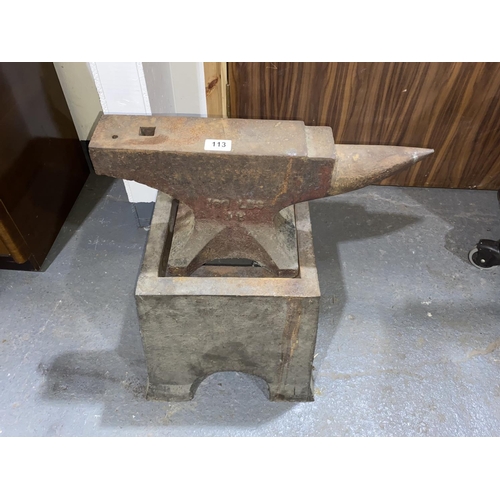 113 - A 100 pound anvil on a cast iron stand