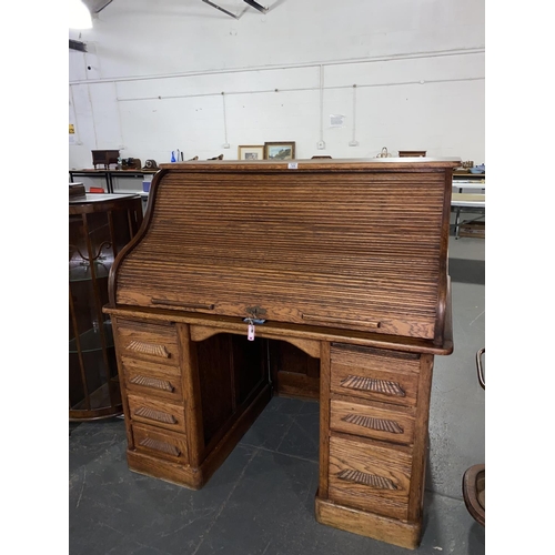 122 - An oak roll top desk