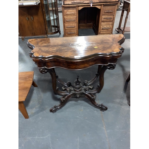 126 - A Victorian burr walnut card table