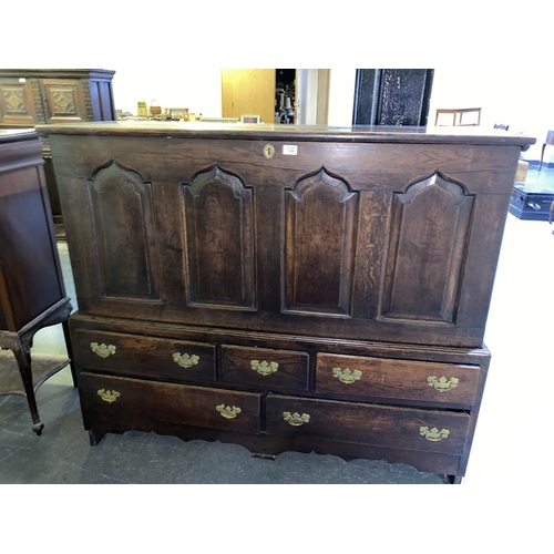 132 - An early oak mule chest with hinged top opening lid and five drawers