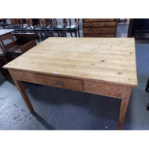 134 - A pine scrub top kitchen table with drawer