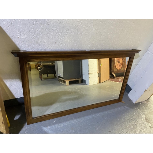 144 - An oak bevel edged overmantle mirror