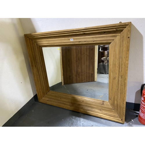 146 - An pine framed bevel edge mirror