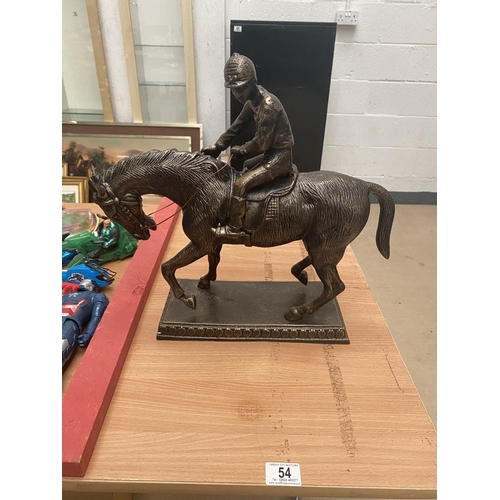 54 - Cast iron horse and jockey figure on stand