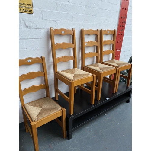 302 - Four pine dining chairs and a coffee table