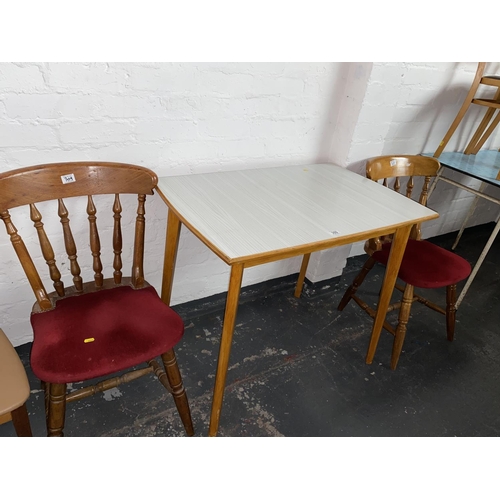 309 - A Formica top dining table and two chairs
