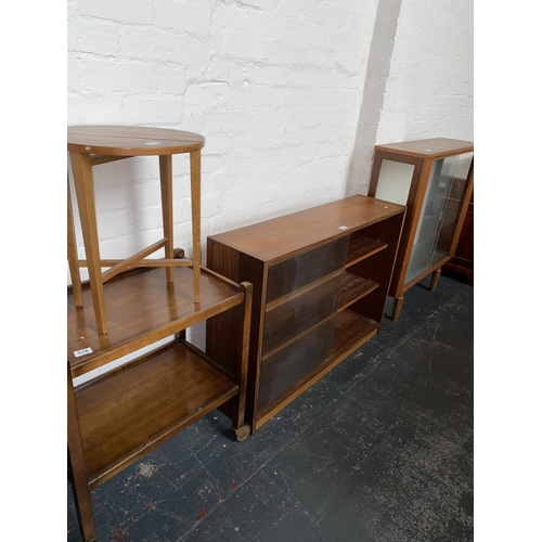 313 - Two teak display cabinets, drinks trolley and a small table